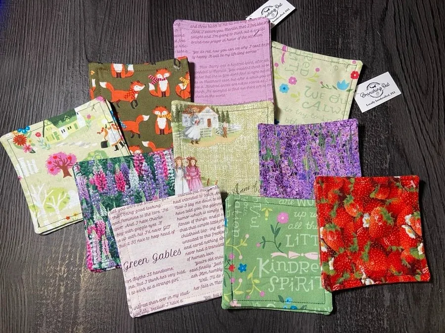 Sewn fabric drink coasters in PEI prints: lupins, foxes and strawberries, by Lynn Taylor