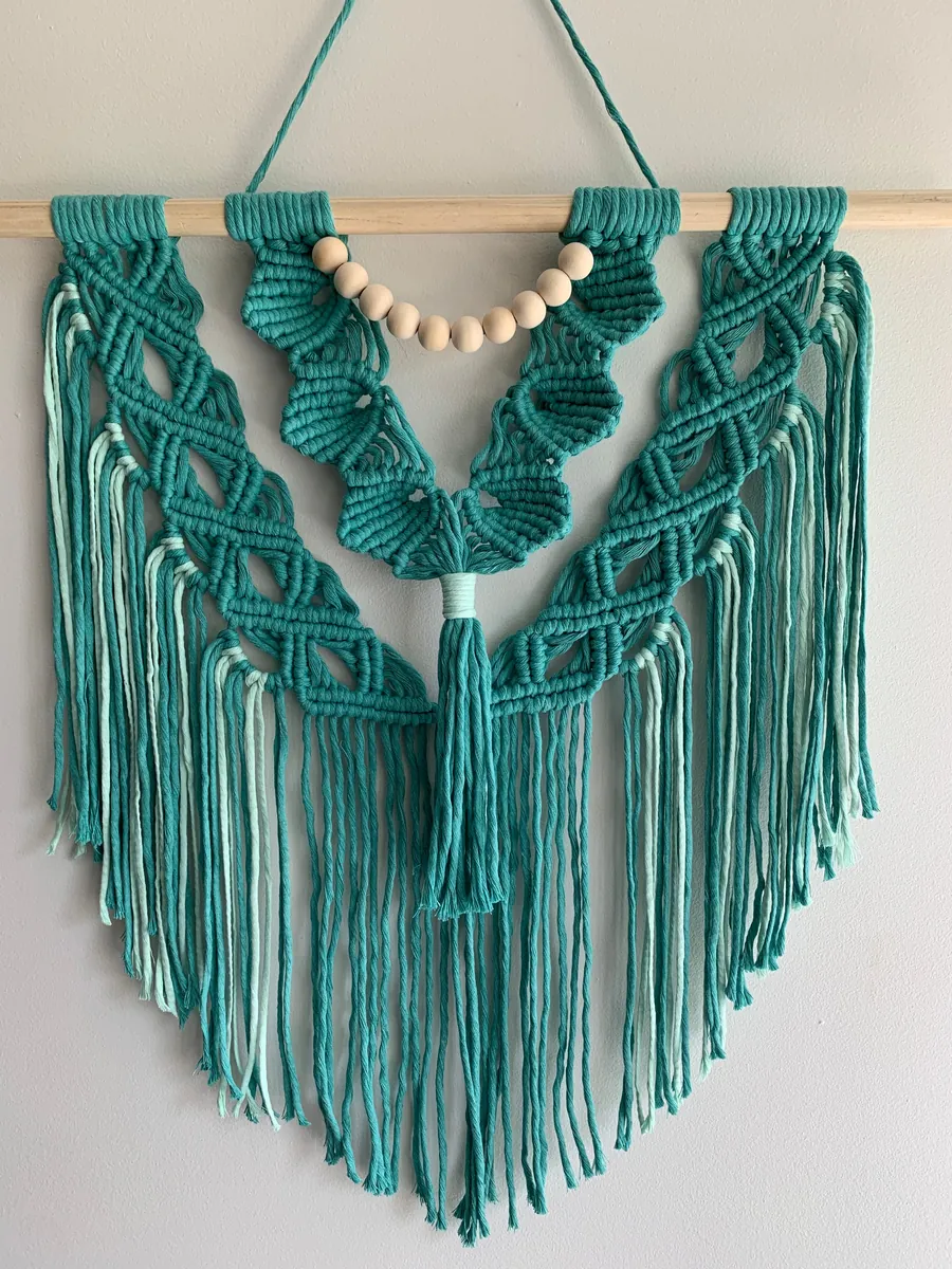 Teal macramé wall hanging by Island Fibrescapes