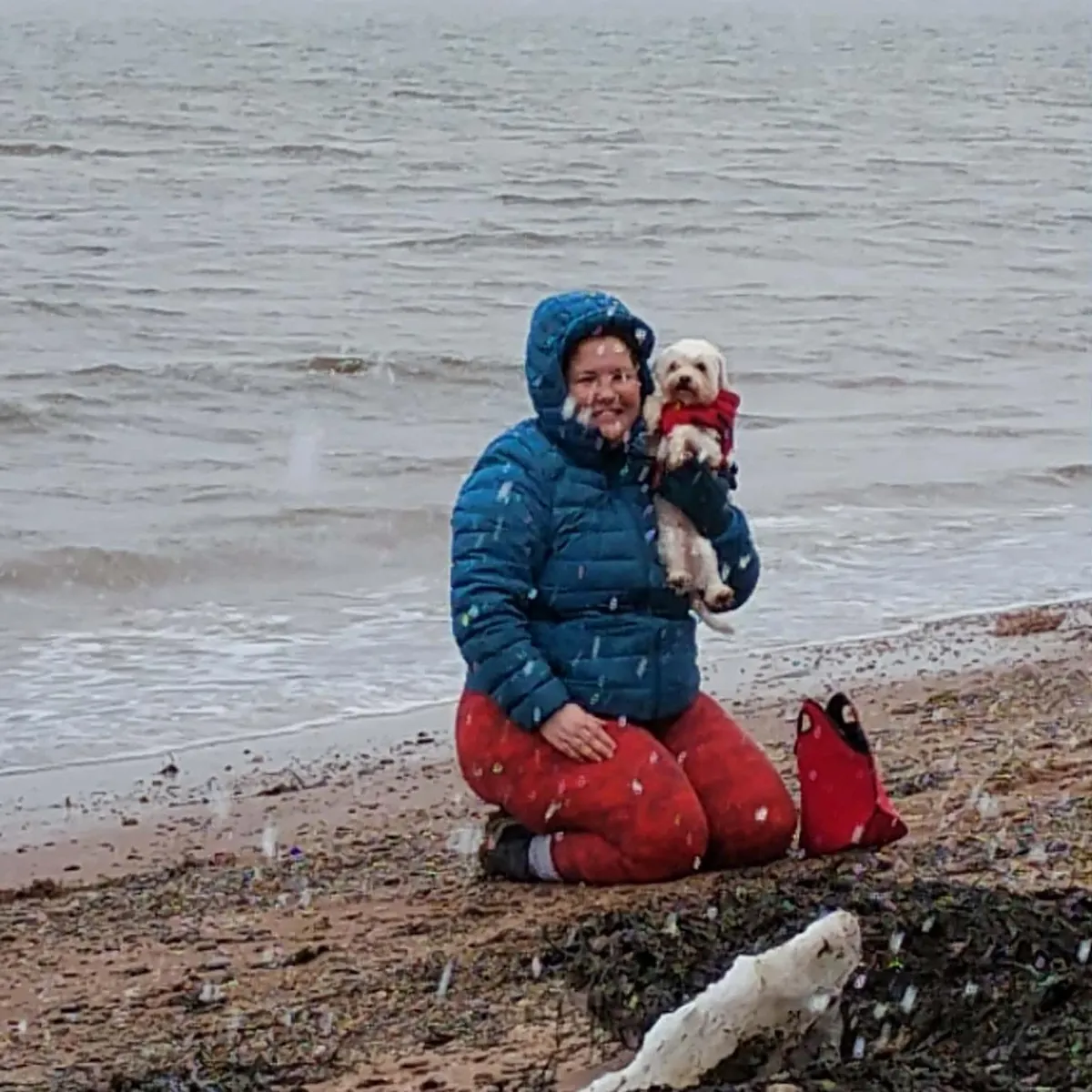 Shannon on the beach with her dog