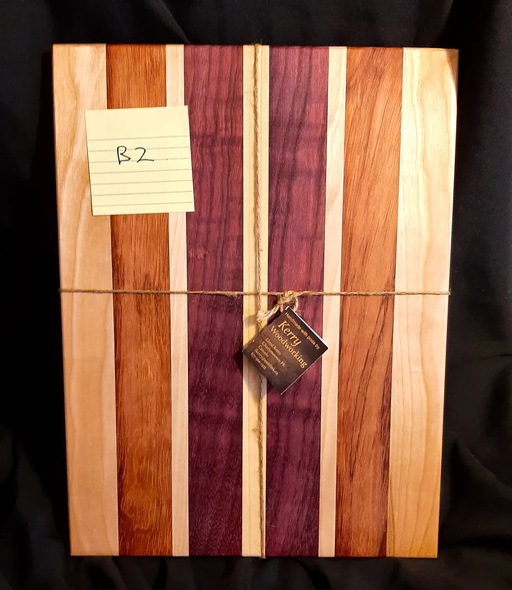 7/8″ Thick Yellow Birch, Bubinga, Birch & Purpleheart Cutting Board by Kerry Woodworking