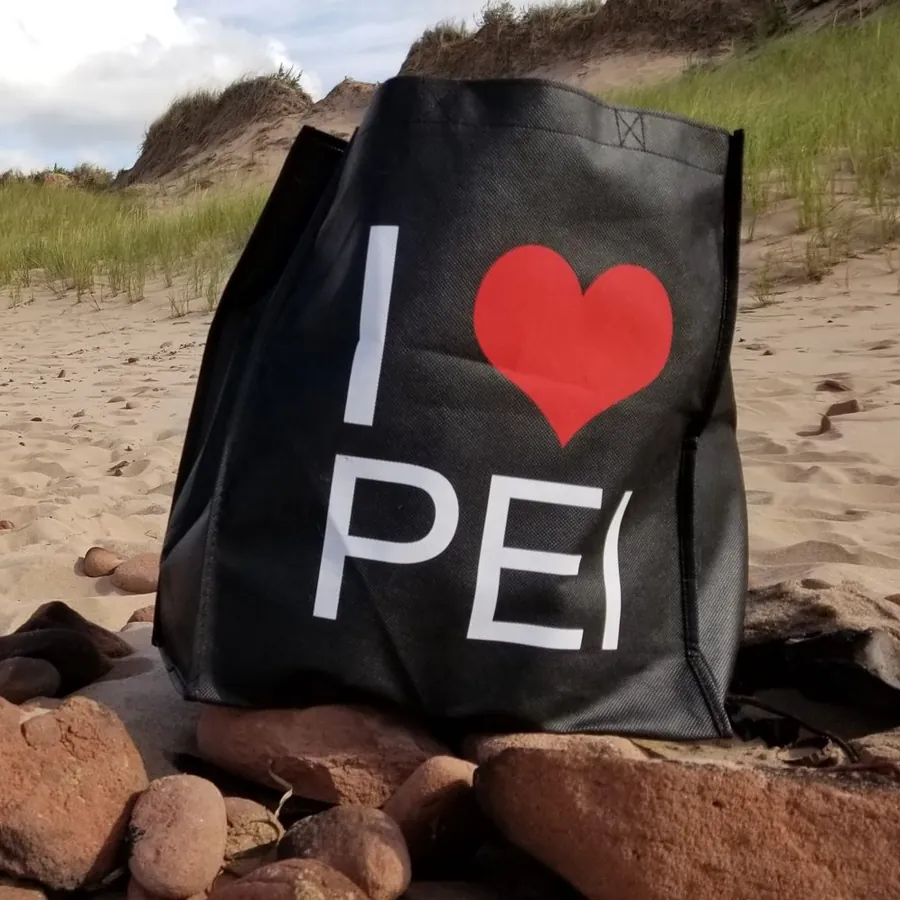 An I Love PEI tote on the beach