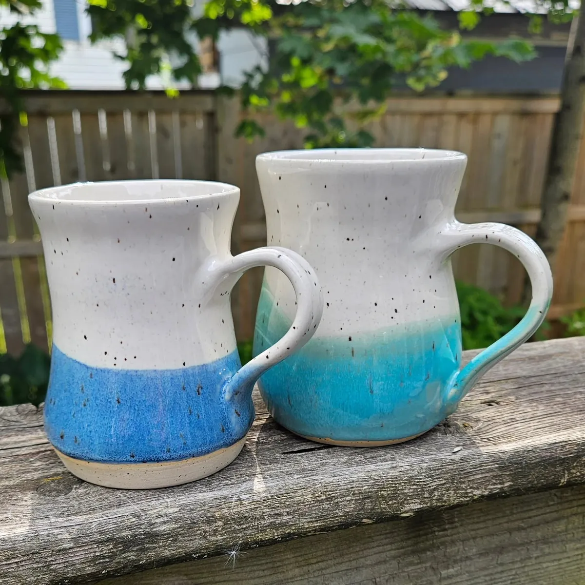 Blue-dipped mugs by Lindsay Bromley Pottery