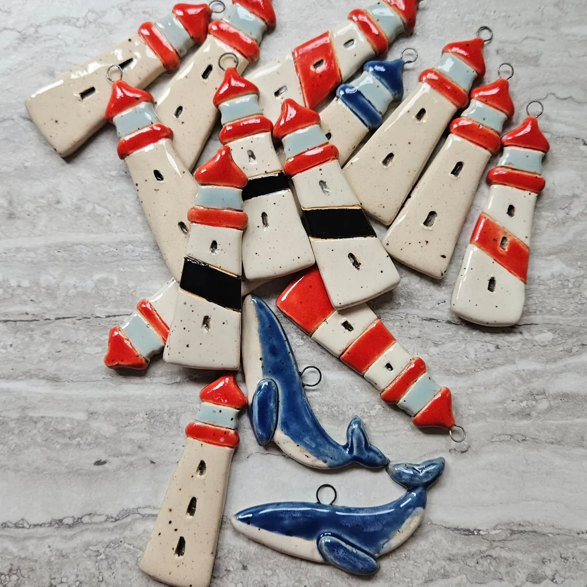 Lighthouse and whale ornaments by Lindsay Bromley Pottery