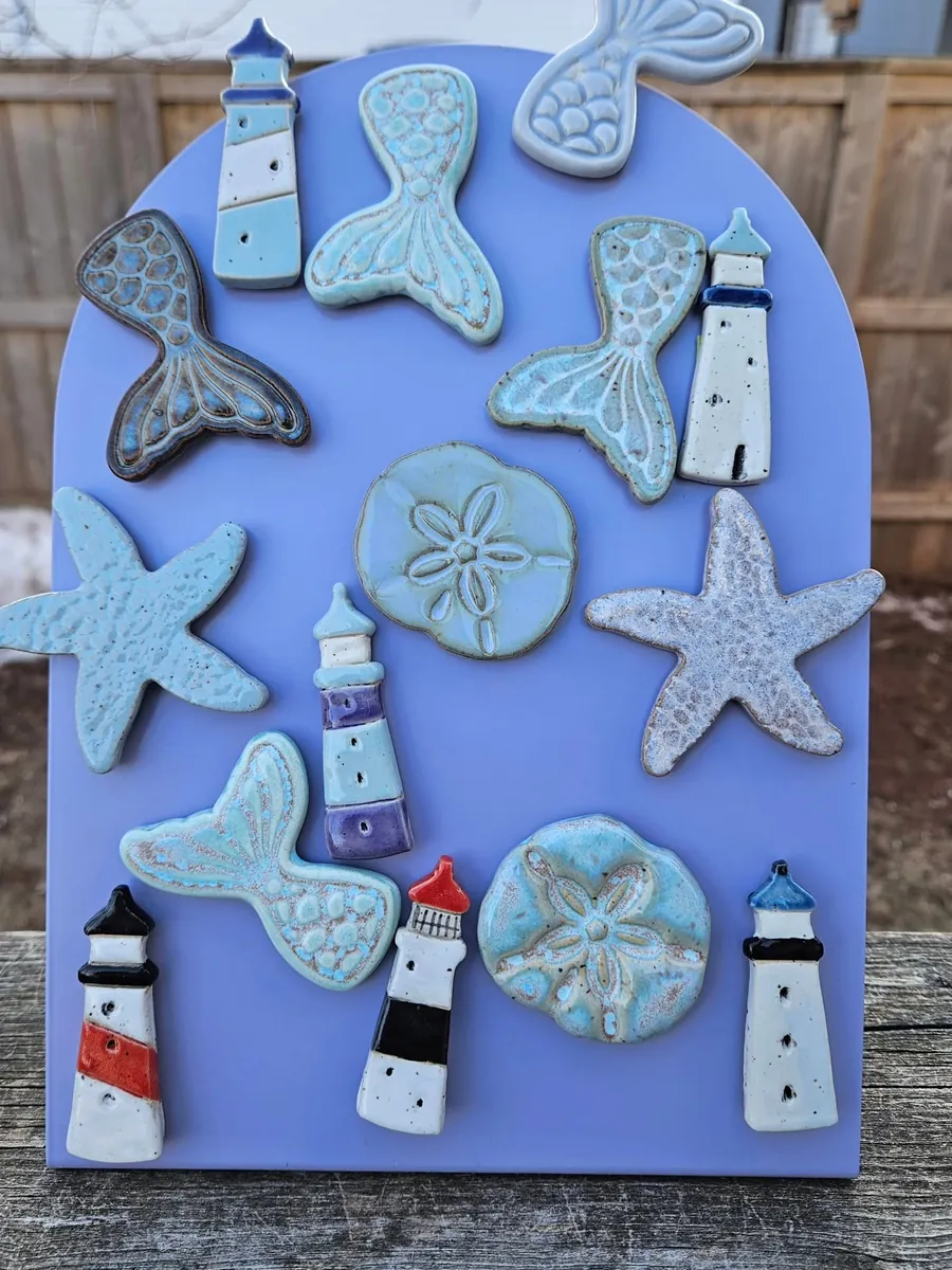 Lighthouses, starfish and mermaid tails by Lindsay Bromley Pottery