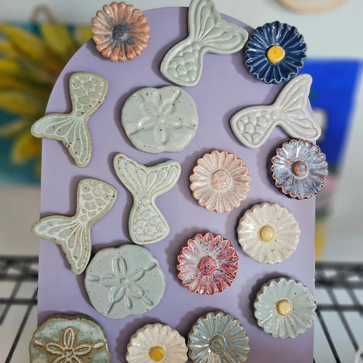 Mermaid tails, sand dollars and flowers by Lindsay Bromley Pottery