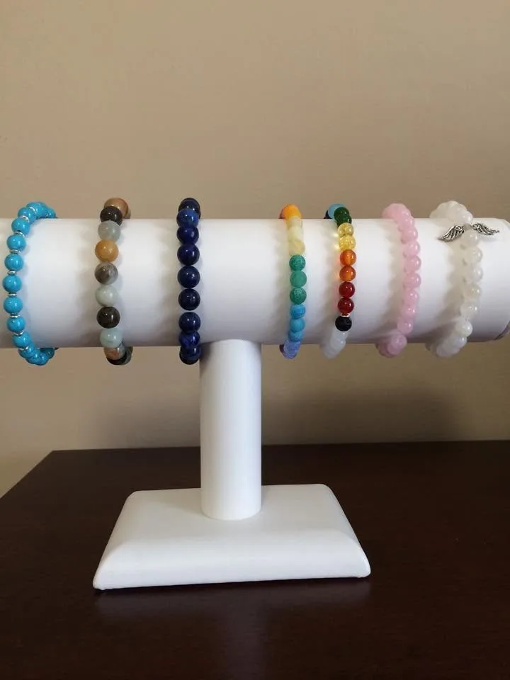 Crystal bracelets on a stand by Nora Cummins, Energy Intuitive