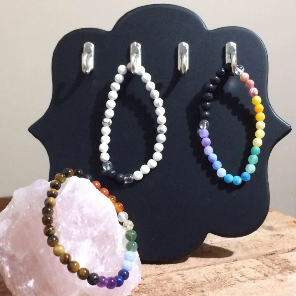 Rainbow and white bead bracelets by Nora Cummins, Energy Intuitive