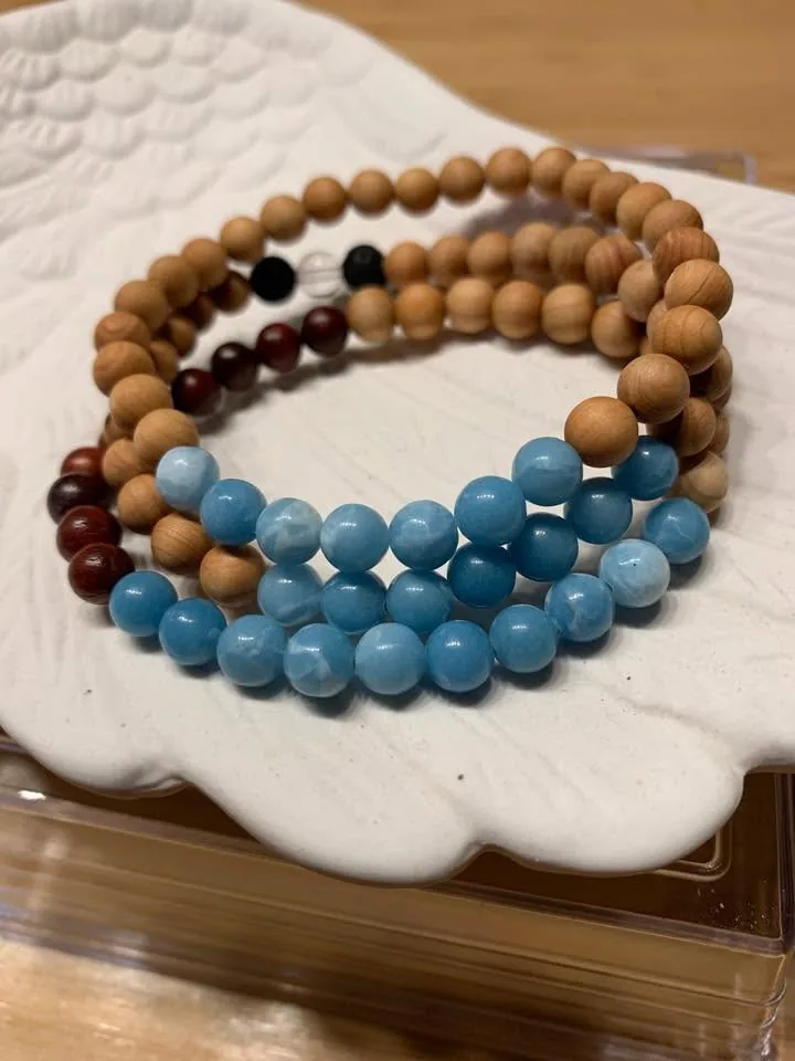 Wood and blue bead bracelets by Nora Cummins, Energy Intuitive
