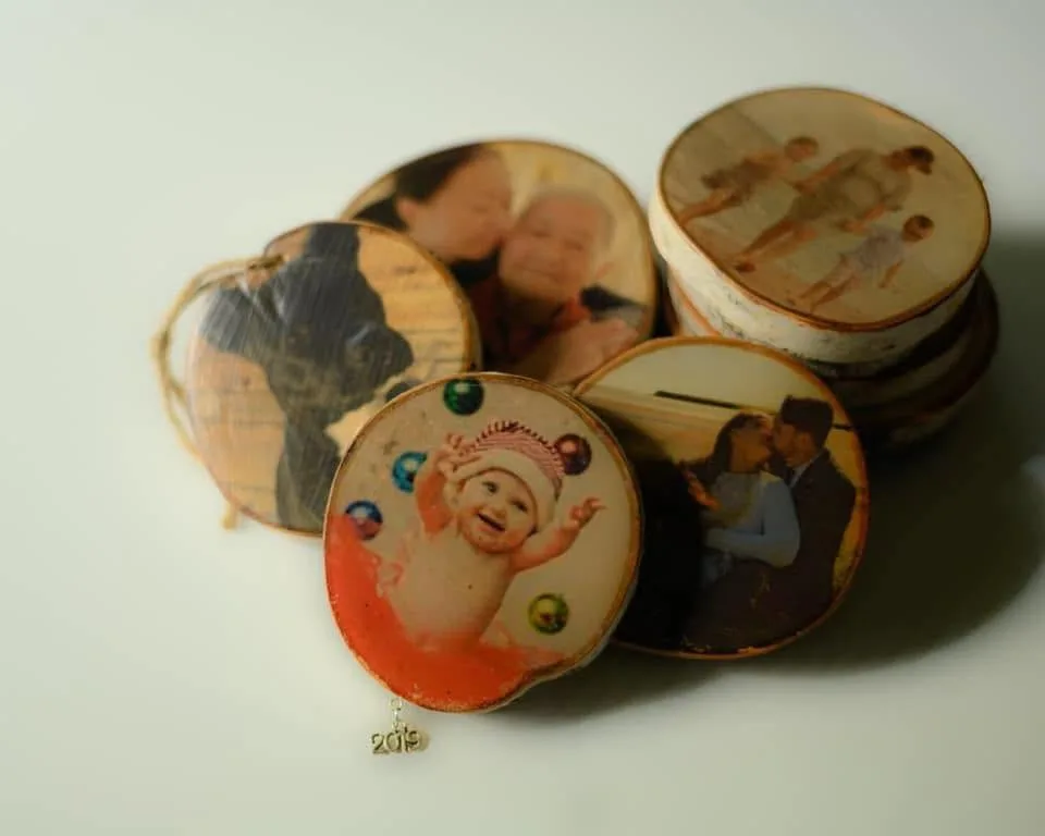 A stack of personalized photo ornaments by Photo Ornaments