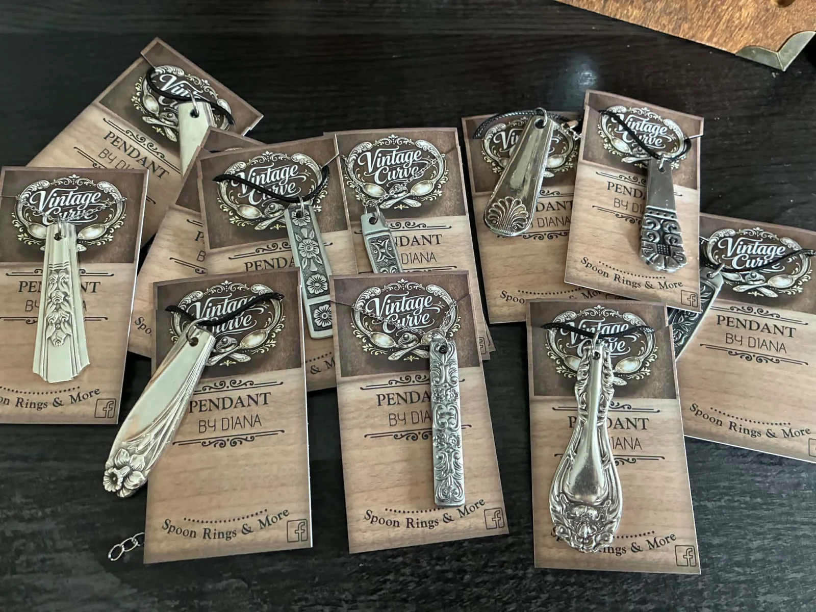 Vintage flatware pendants on display cards by Vintage Curve